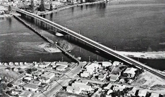 historic photo of large bridge over body of water